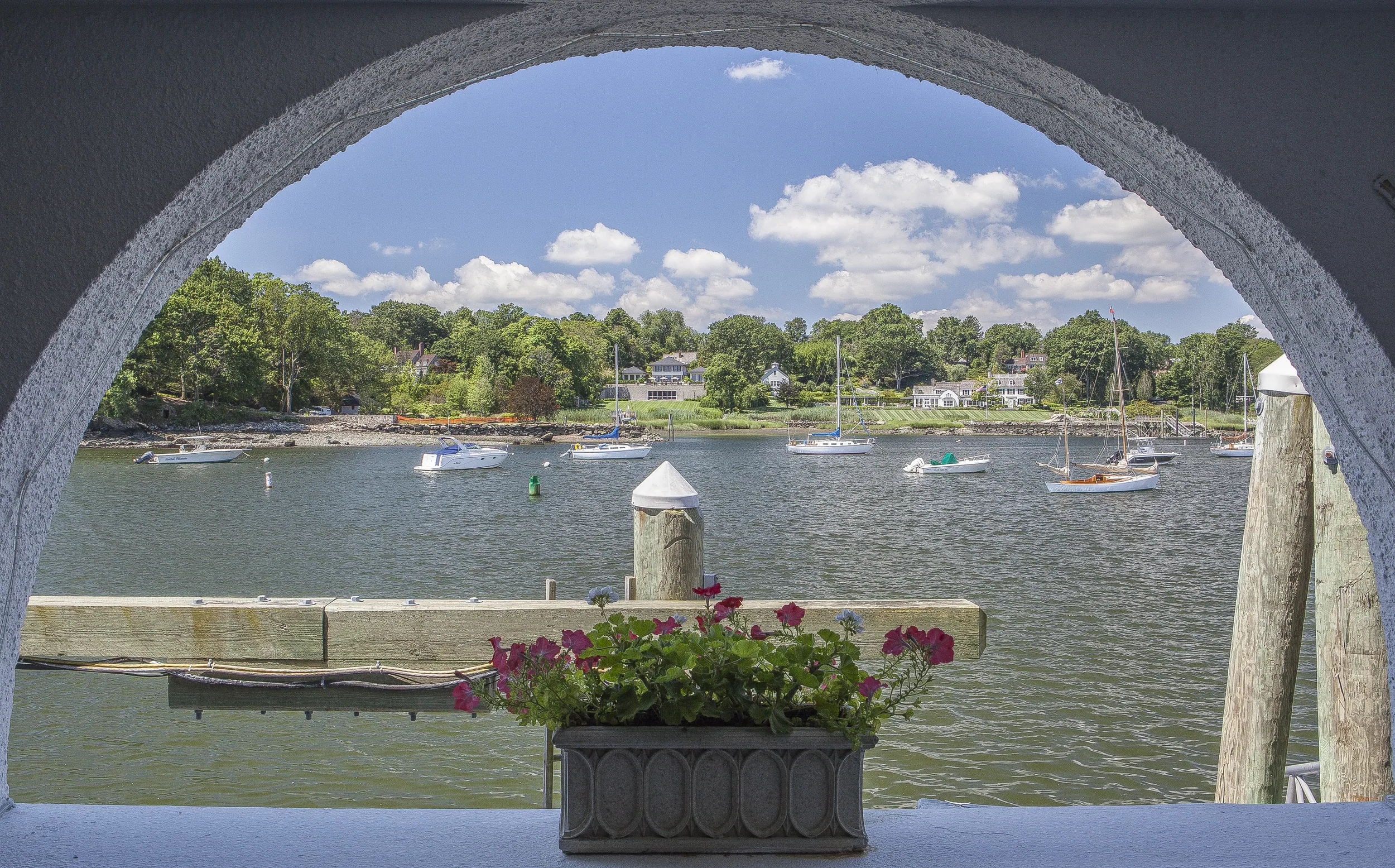 Greenwich harbor view through architectural arch