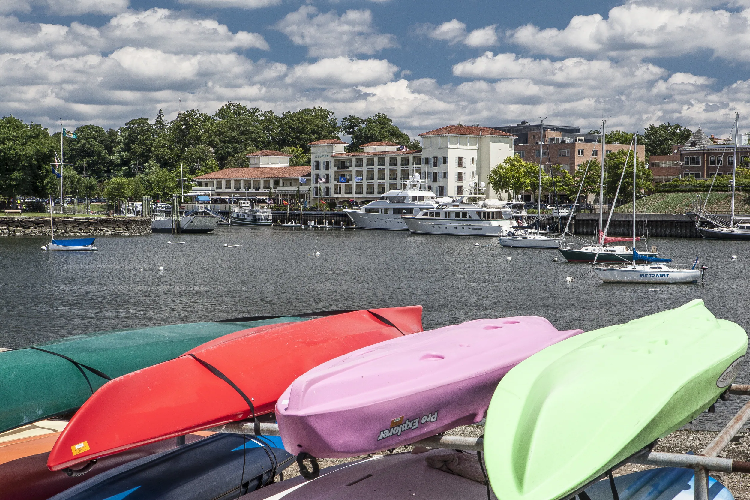 Greenwich harbor with colorful kayaks and recreational boats