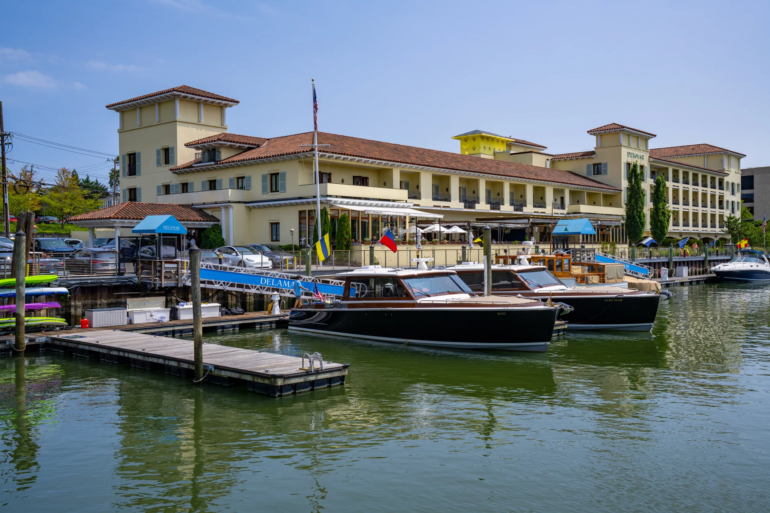 L'Escale waterfront restaurant exterior with harbor views and elegant French dining atmosphere